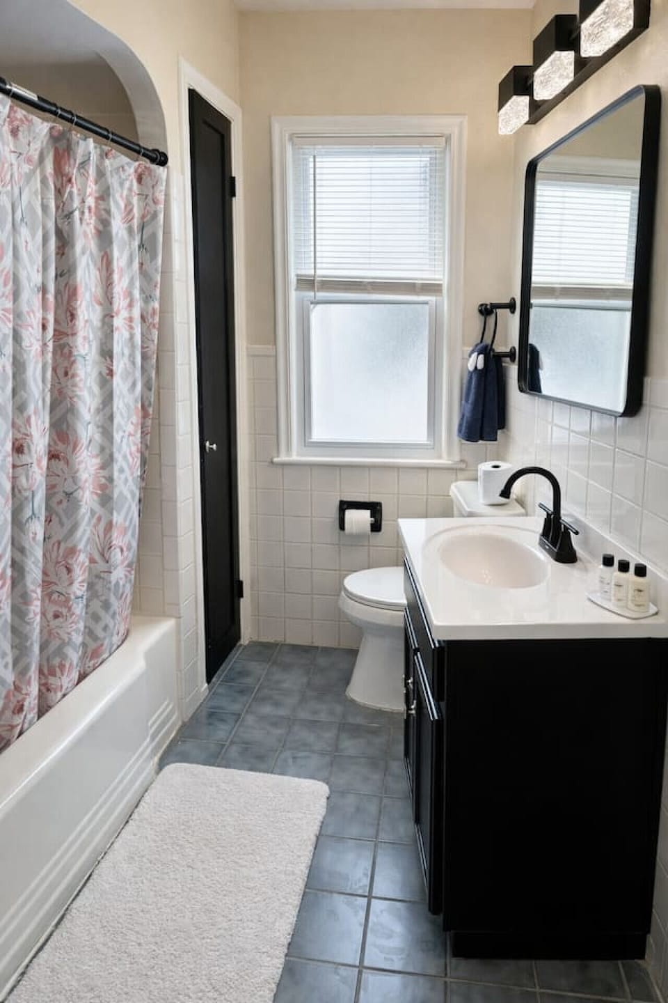 Relax and recharge in this bright, clean bathroom that perfectly balances modern updates with classic charm.