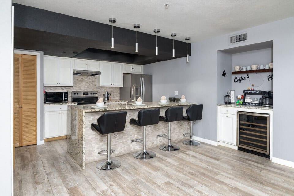 Fully equipped kitchen with high-end finishes and a built-in wine cooler for the connoisseur.
