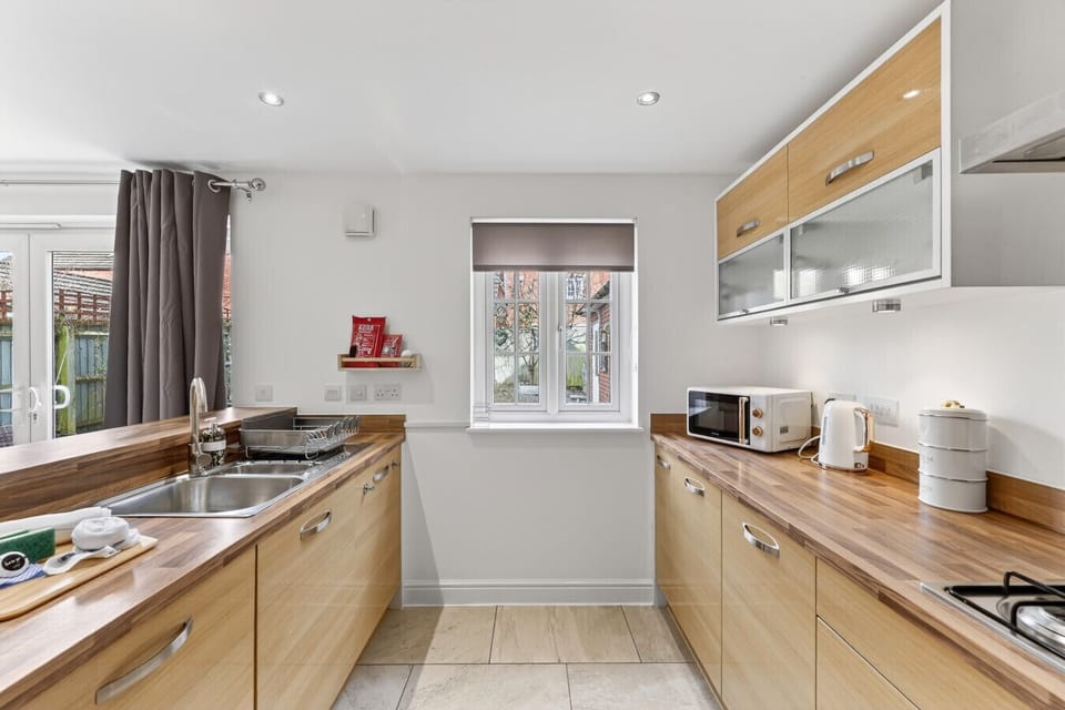 A modern, fully equipped kitchen offers all the essentials to cook and dine at your leisure.