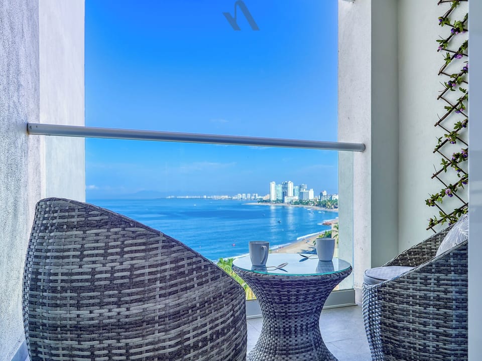 Private balcony with stunning ocean and coastal views, perfect for morning coffee, evening breezes, and unforgettable sunsets.