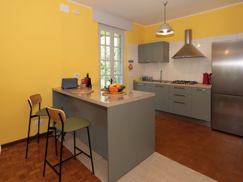 Furniture, Kitchen, Interior Design, Flooring, Countertop, Wood, Kitchen Appliance, Major Appliance, Cabinetry, Floor