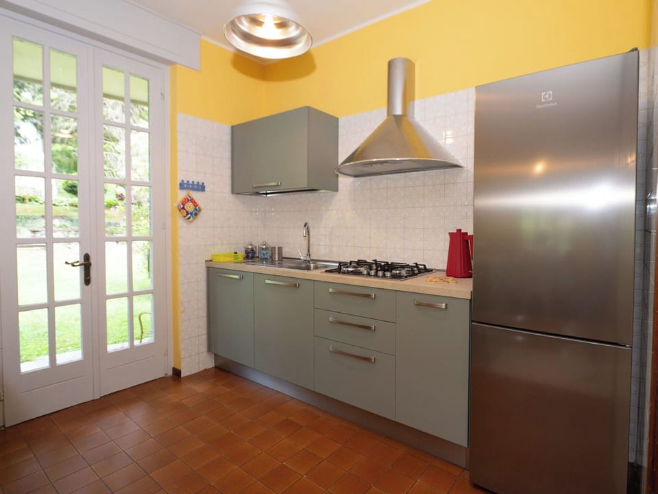 Kitchen, Kitchen Appliance, Countertop, Major Appliance, Cabinetry, Flooring, Interior Design, Wood, Kitchen Stove, Furniture