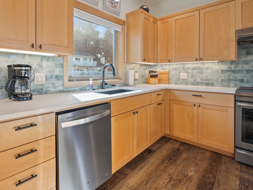 Your fully equipped kitchen features maple cabinets, granite counters, and stainless appliances perfect for creating memorable meals during your stay.