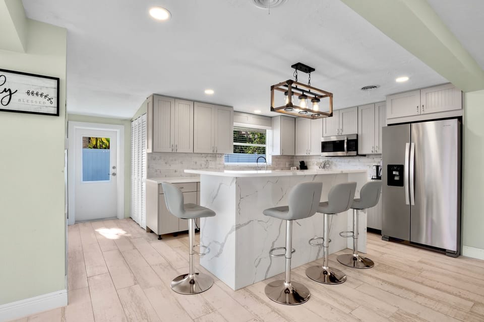 Kitchen with high top seating at breakfast bar