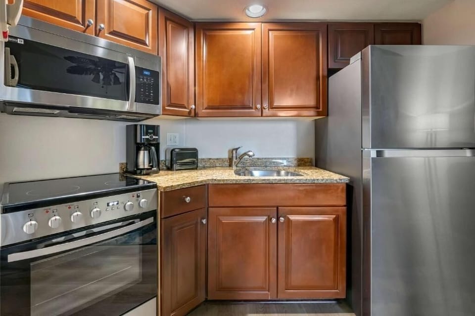 Brew morning coffee and prep snacks with modern appliances.