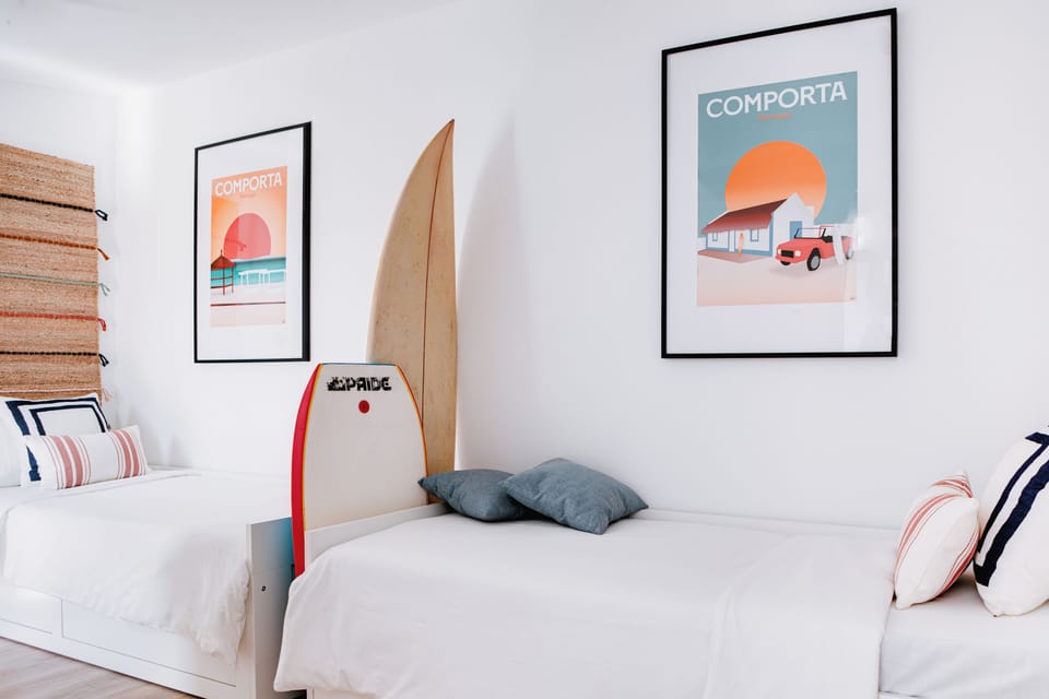 Bedroom with two single beds, natural light, beach-inspired décor and a relaxed 
