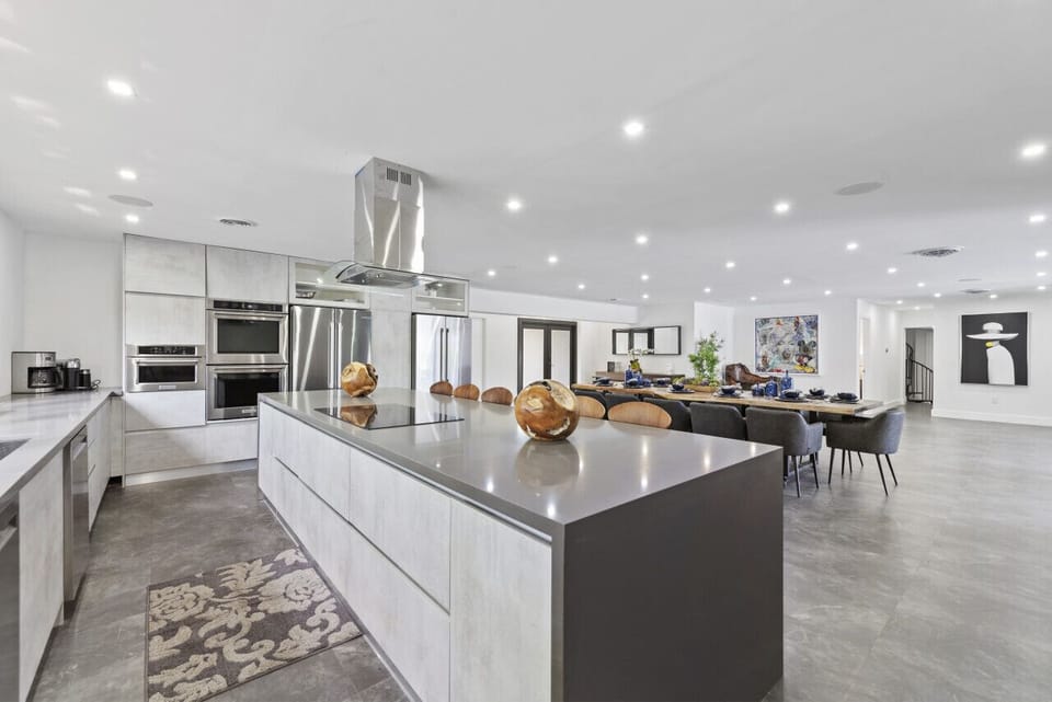 Gourmet Kitchen with Dual Ovens, Two Refrigerators, Breakfast Bar with Seating for Five