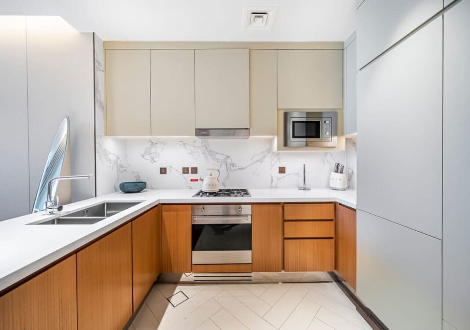 Fully-Equipped Gourmet Kitchen: Step into this fully-equipped gourmet kitchen, a pristine space where modern design meets culinary functionality.