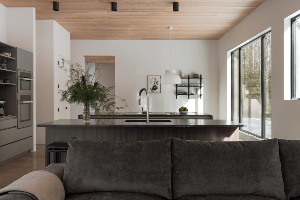 Chef-inspired kitchen featuring premium Miele appliances and sleek modern lines.