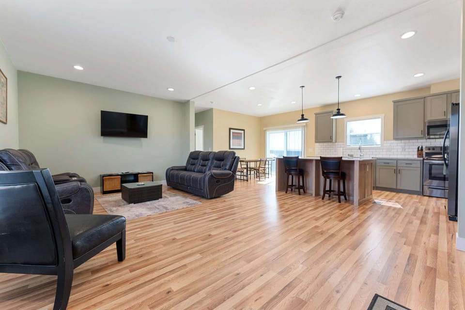 Bright great room with open floor plan and views — the perfect gathering space for hikers, families, and ATV groups.