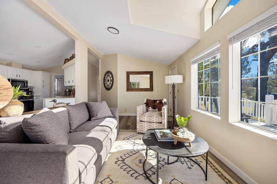 The living area opens to the kitchen and dining areas