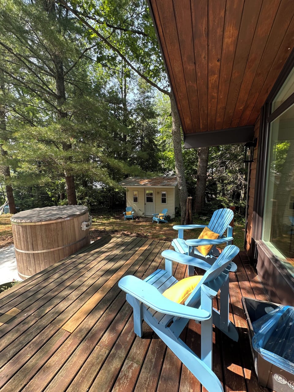 Lots of seating on the deck with cedar hot tub and lake views !