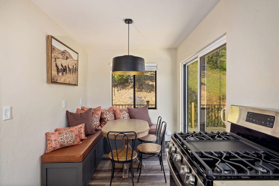 Built in seating around the family dining table, open to the deck