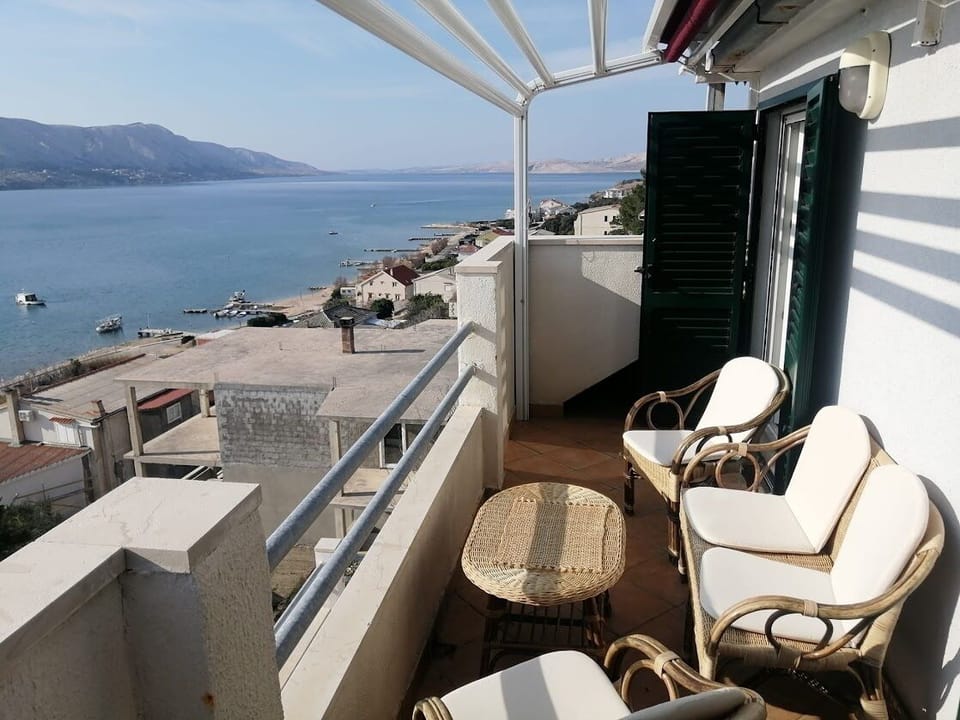 View of the balcony and the sea.