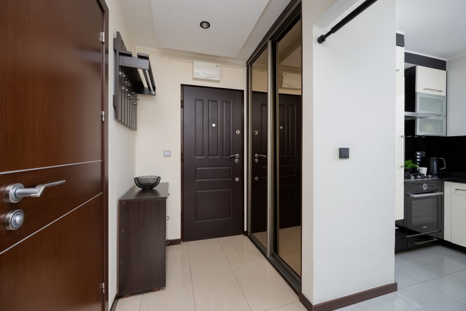 Welcoming entrance hall with storage space and clean layout.