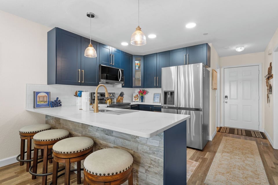 Spacious island with bar seating, perfect for gathering.