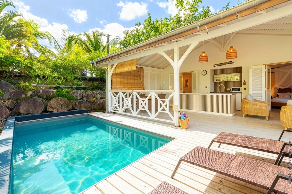 Absolute relaxation at Villa Grenadille: private pool and spacious terrace opening onto a warm interior in Diamant.