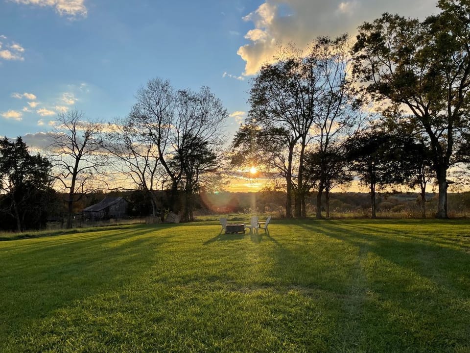 View from front/side yard, western sunset and firepit.