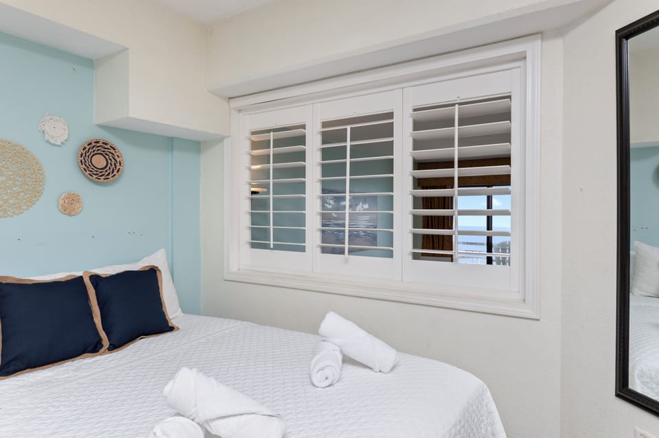 Cozy coastal bedroom with crisp linens and charming decor