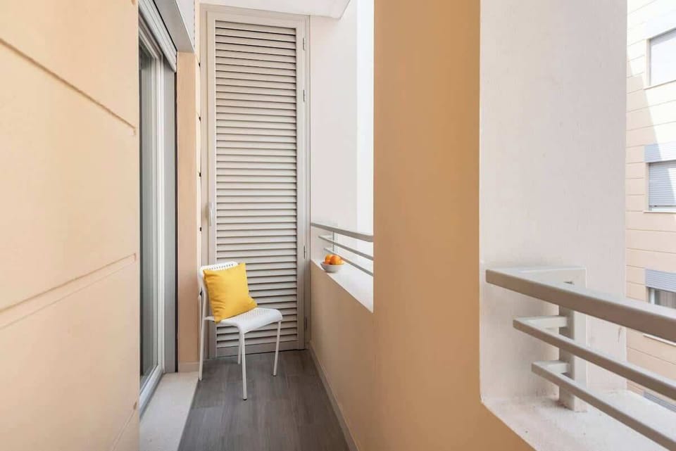 A Balcony that faces the courtyard with a garden.