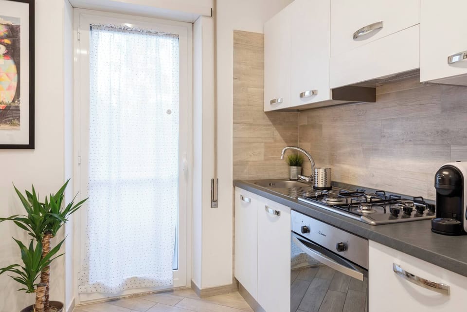 Full kitchen with a little balcony.