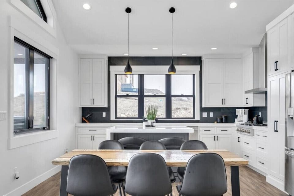 Open kitchen and dining area with lake-view windows