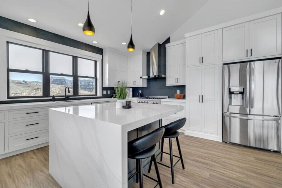 Fully equipped kitchen with oversized island and lake-view windows