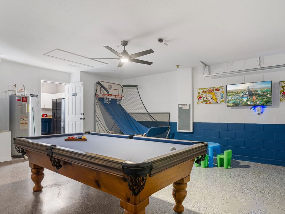 Games room completed with basketball hoop and pool table. Tournament anyone?