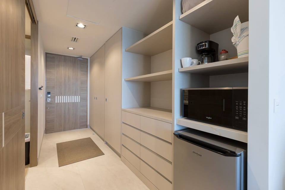 Refrigerator, Coffee maker, microwave, ample space for your clothes and travel gear. 