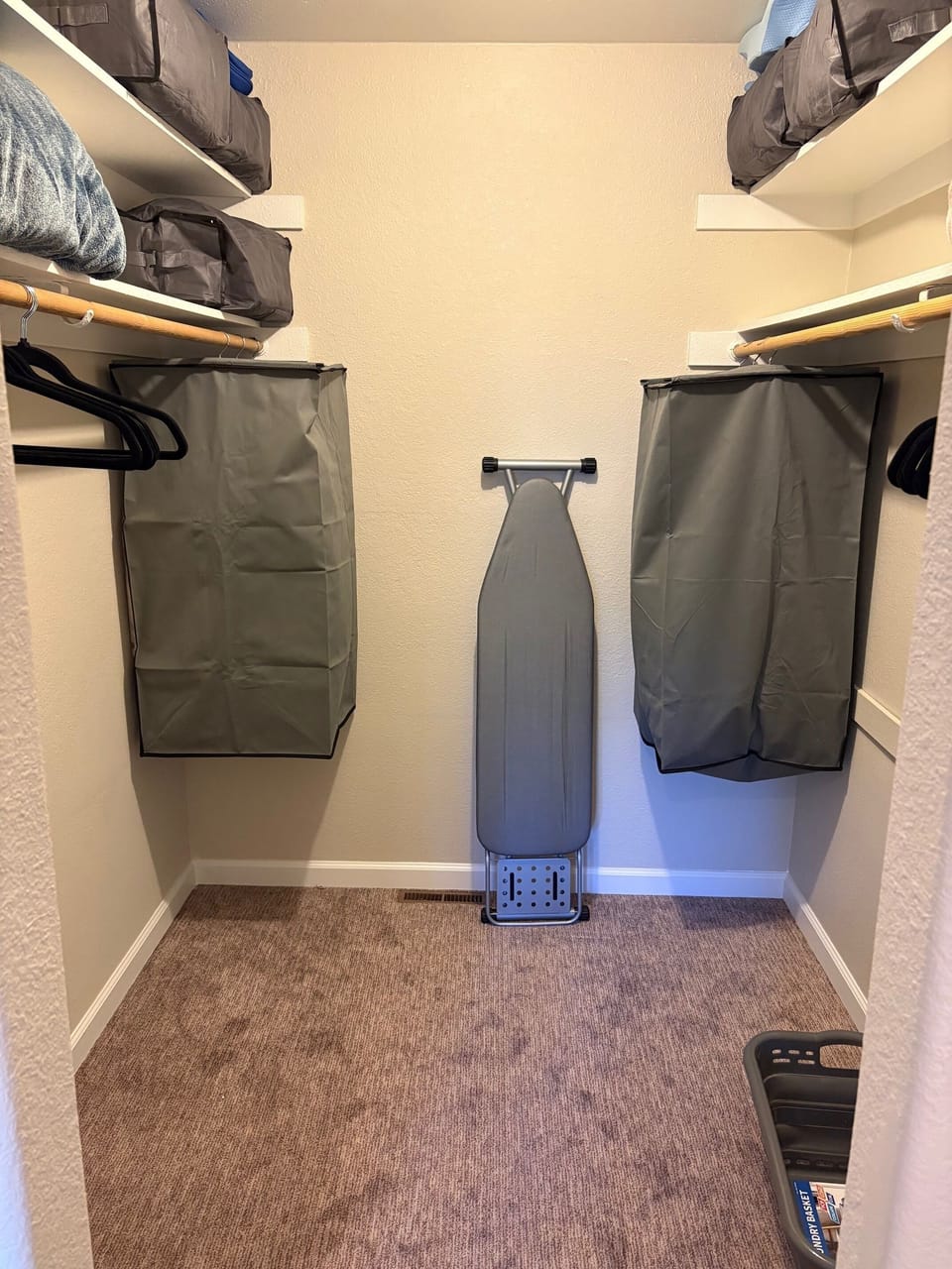 Spacious primary closet with ample hanging space.