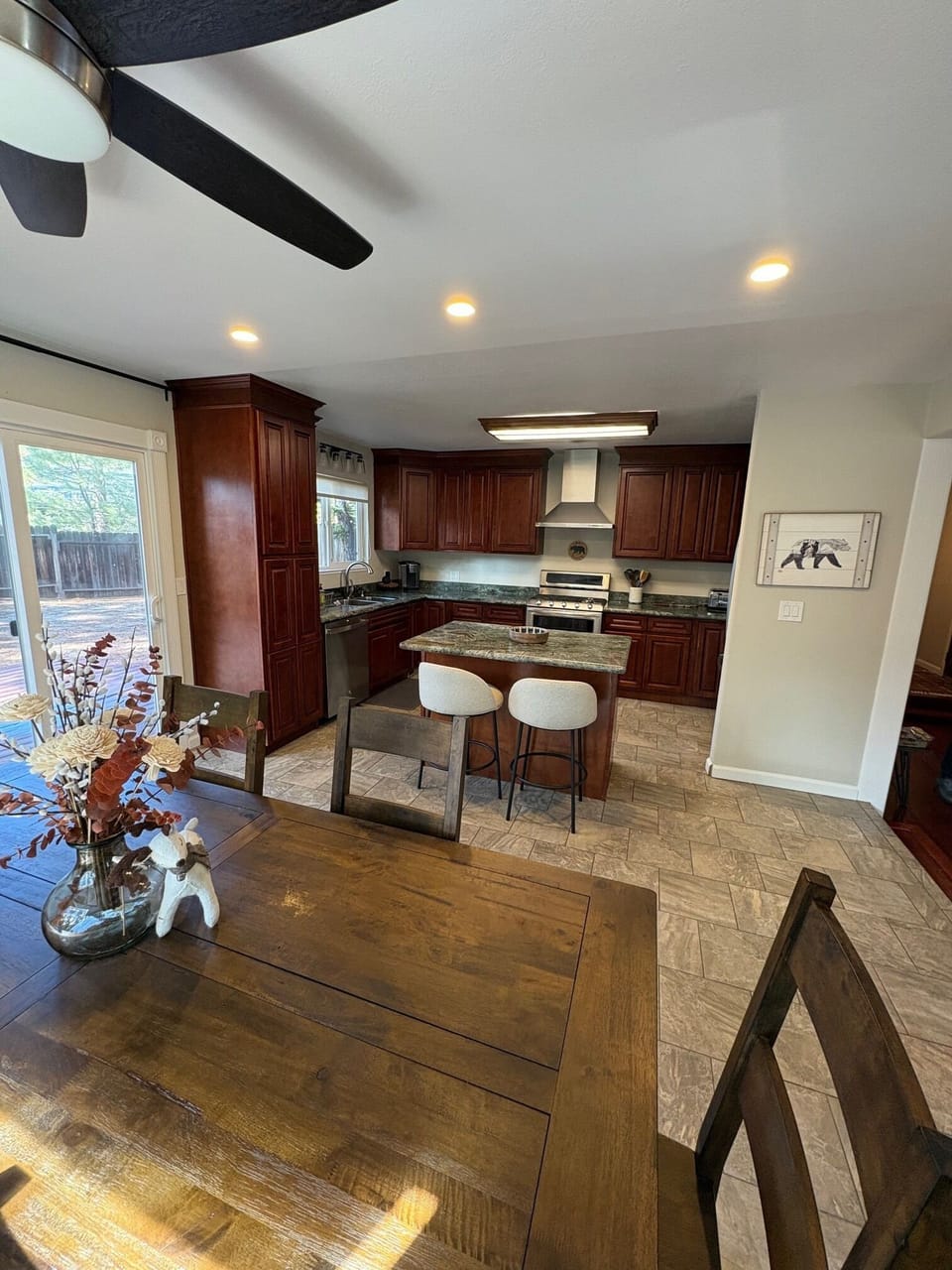 Fully equipped kitchen with easy flow to dining area.