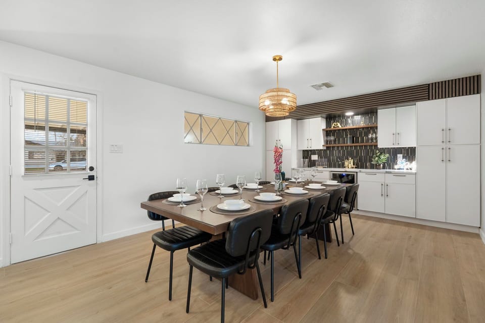Large dining area with bar and tons of glassware for our guests to enjoy drinks