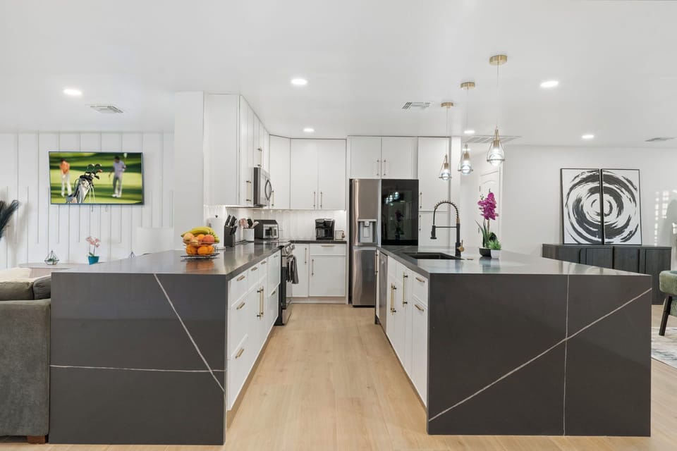 Incredible gourmet kitchen with large island and tons of prep space. 
