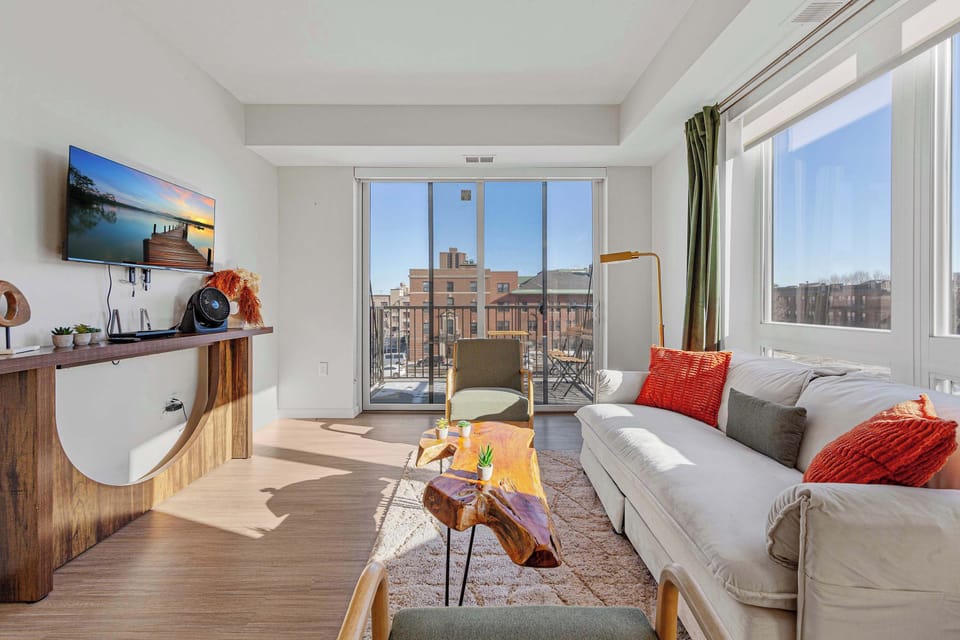 Relax in a bright, open living space designed for comfort and connection. Enjoy streaming your favorites, lounging after a long day, or gathering with friends while natural light creates an uplifting, home-like feel.