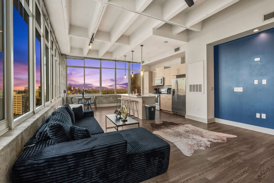 Stretch out in a comfortable living space that blends style and function. Whether working remotely or winding down, this area offers room to relax and enjoy the city atmosphere.