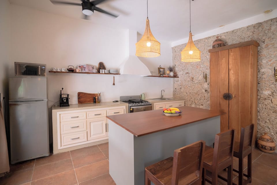 Kitchen, has kitchen utensils, coffee machine, and basic cooking tools