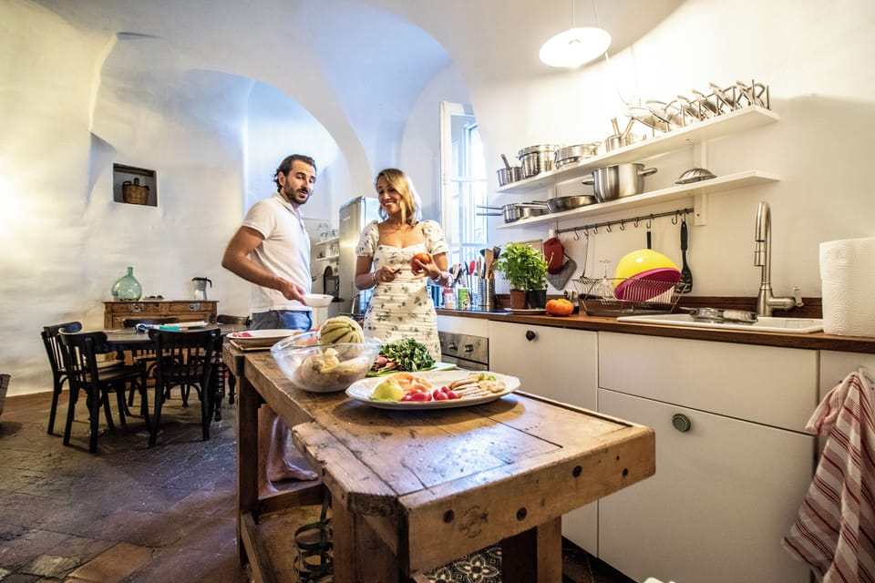 Authentic terracotta floors and rustic wooden island for cooking together.
