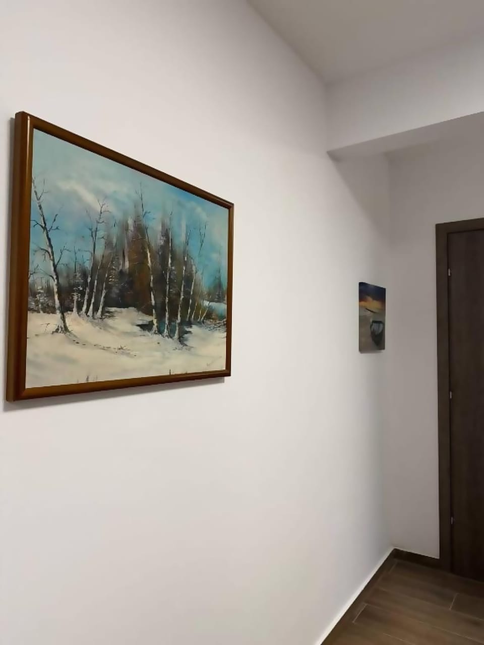 Hallway detail with tasteful wall art.
