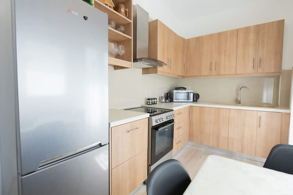 Functional kitchen and dining setup perfect for preparing and enjoying meals.