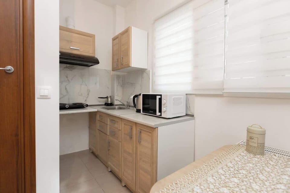 Fully equipped kitchen with modern appliances and ample storage space.