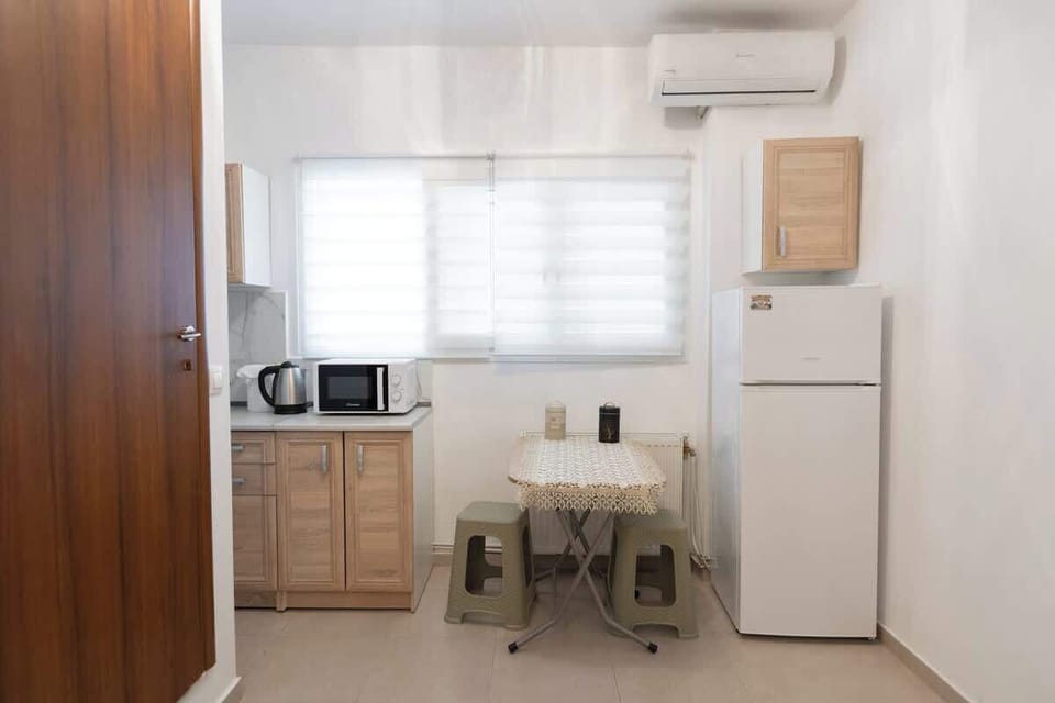 Bright kitchen and dining area, perfect for preparing home-cooked meals.