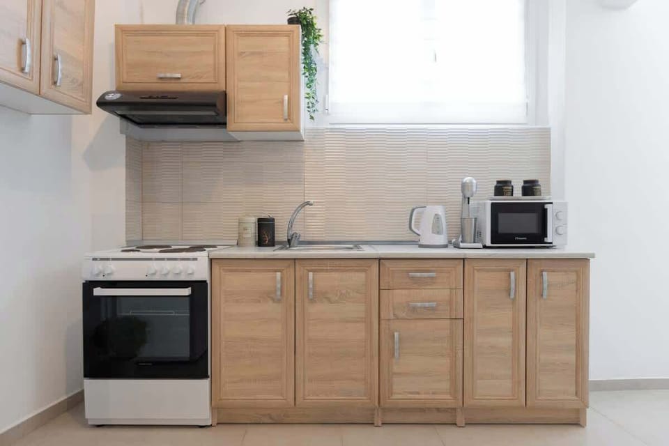 Fully equipped kitchen with oven, stove, and essentials.
