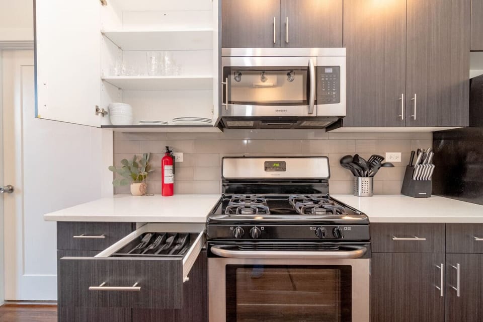 Modern kitchen with stainless steel appliances, sleek cabinetry, and ample counter space.