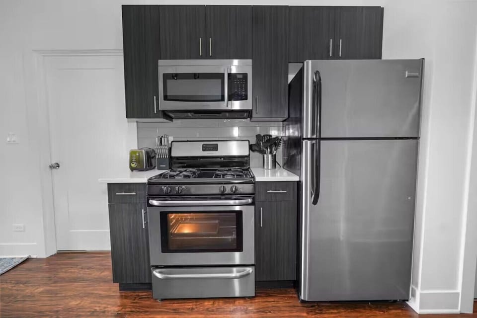 Full kitchen with stainless steel appliances