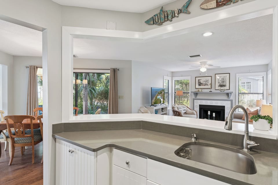 Your open kitchen flows seamlessly into the living space, creating perfect sightlines for socializing while you cook.