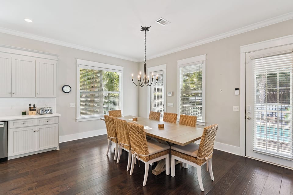 Gather around your elegant dining table where memories are made over shared meals in this bright, welcoming space.