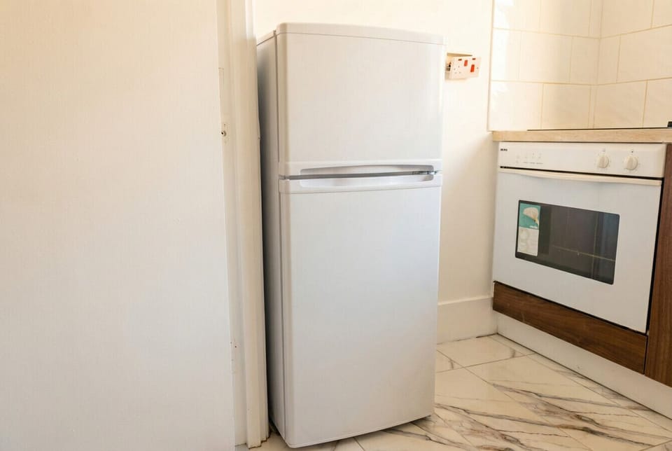 Full-size fridge and oven give you everything needed for home cooking.