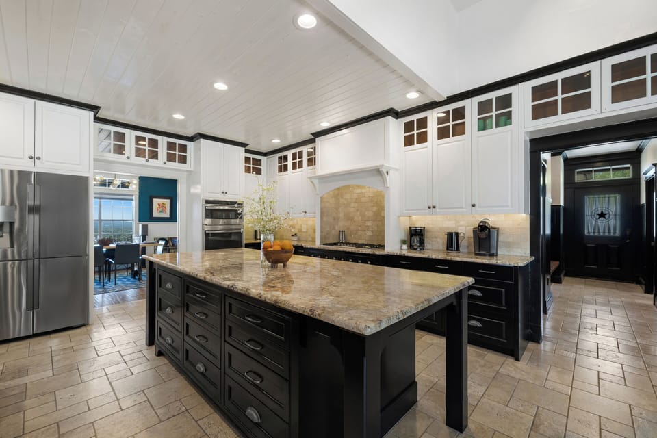 Your gourmet kitchen awaits with granite countertops, premium appliances, and abundant prep space for memorable meals together.