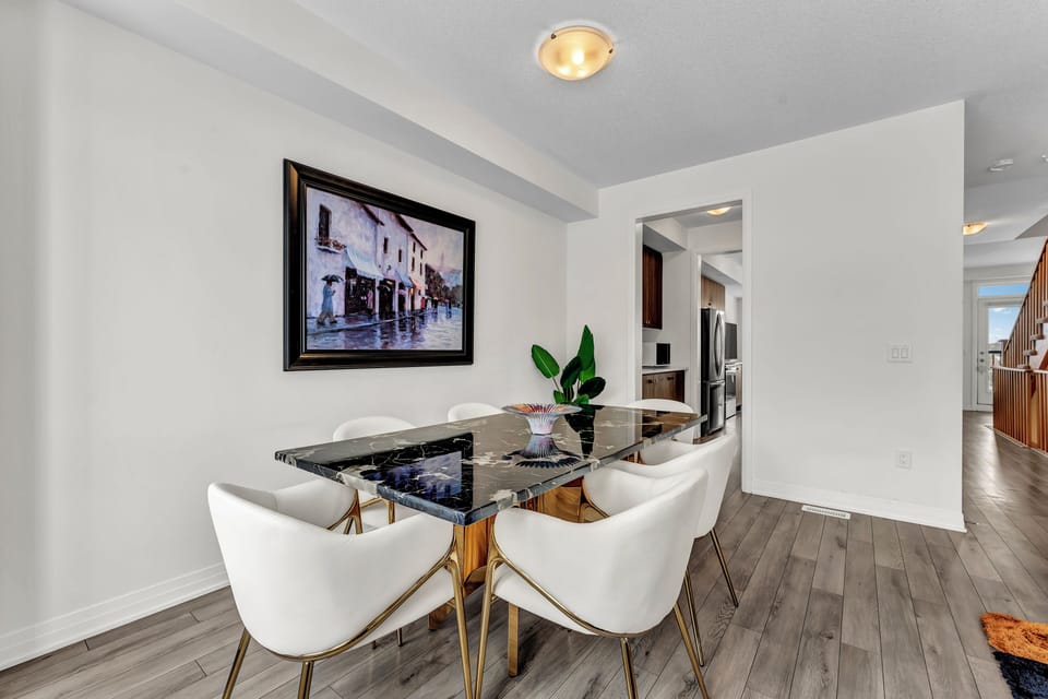 Another angle of the dining area and kitchen entryway