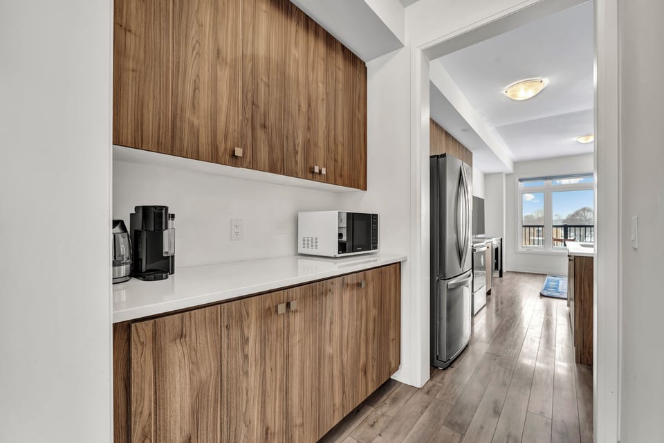 Custom cabinetry and a built-in coffee station/prep area